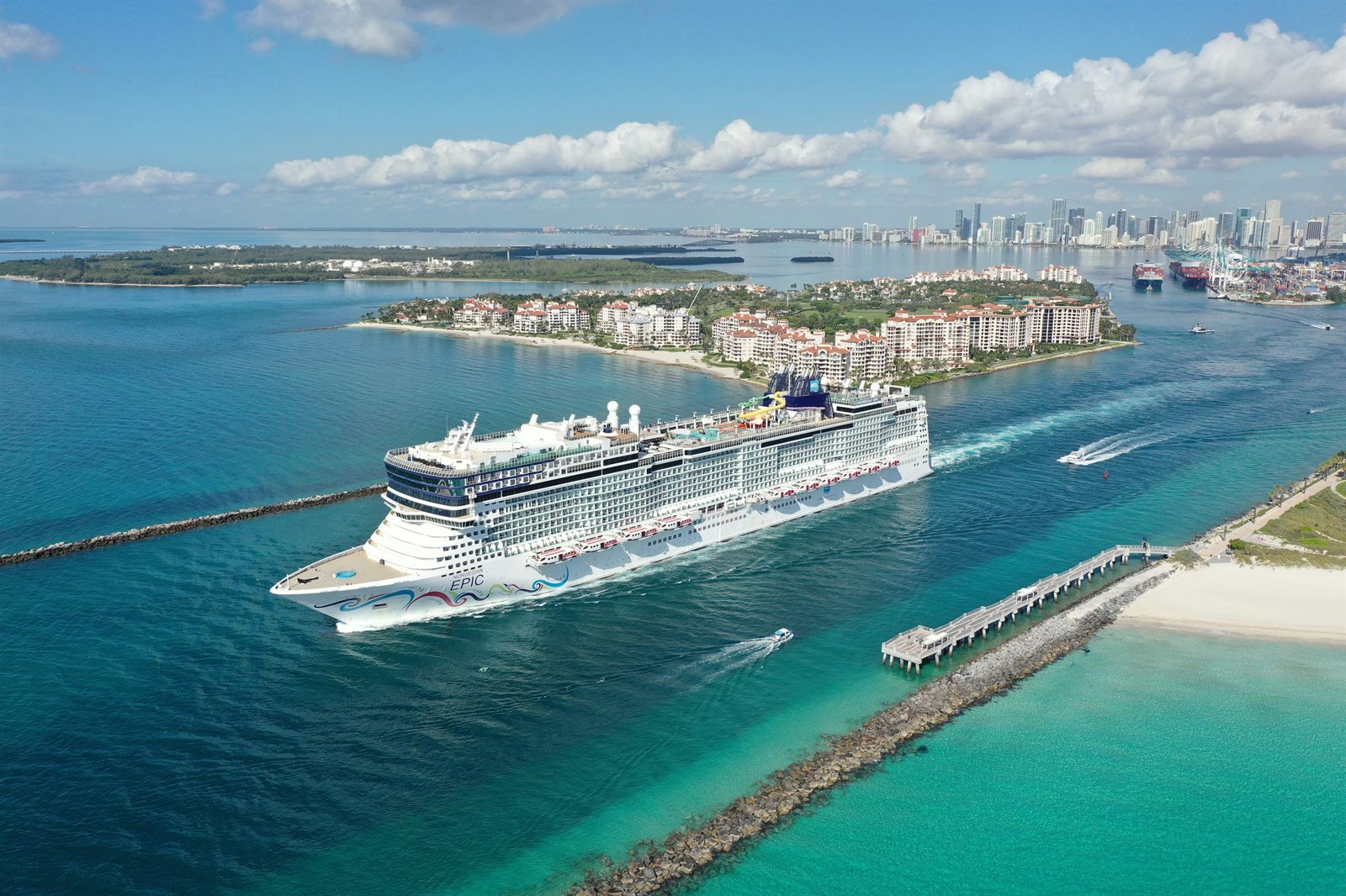 Cruise ship leaving Port Everglades past the jetty and beach